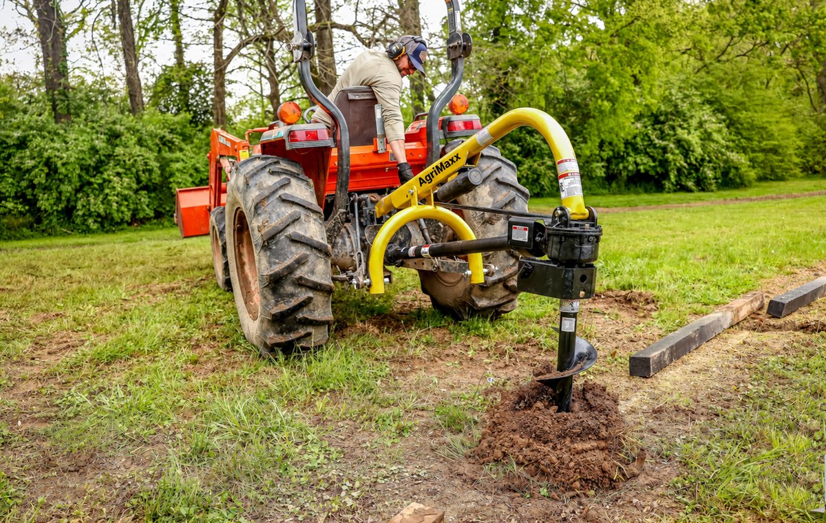 AgriMaxx PHD18 post hole digger boring a fence-post hole next to landscape timbers -- auger sold separately