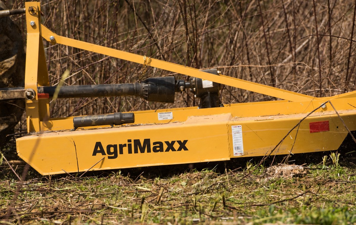 AgriMaxx RC72 rotary cutter cutting through dry brush and saplings